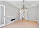 A spacious dining room with stylish accents and an open doorway to the kitchen at 4168 Arapaho Dr, Powder Springs, GA 30127
