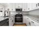 Well-equipped kitchen with stainless steel appliances and attractive countertops at 4168 Arapaho Dr, Powder Springs, GA 30127