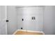 Convenient laundry room space with overhead shelving at 4168 Arapaho Dr, Powder Springs, GA 30127