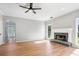 Inviting living room features an elegant fireplace and light-filled entry at 4168 Arapaho Dr, Powder Springs, GA 30127
