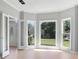 A sunlit living room features a bay window and an open doorway at 4168 Arapaho Dr, Powder Springs, GA 30127