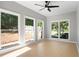 Light filled sun room with multiple windows offering backyard views at 4168 Arapaho Dr, Powder Springs, GA 30127