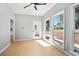 Bright sunroom with backyard views and an adjacent entry door at 4168 Arapaho Dr, Powder Springs, GA 30127