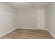 Basement area with wood-look flooring and bright white walls at 42 Breckenridge Dr, Powder Springs, GA 30127