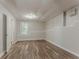 Finished basement area featuring wood-look flooring and natural light at 42 Breckenridge Dr, Powder Springs, GA 30127