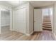 Finished basement area with hardwood floors and a staircase access at 42 Breckenridge Dr, Powder Springs, GA 30127
