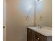Bathroom with a dark wood vanity and a mirror above the sink at 42 Breckenridge Dr, Powder Springs, GA 30127