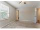Spacious bedroom features natural light from the window and a ceiling fan at 42 Breckenridge Dr, Powder Springs, GA 30127