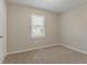 Bedroom with neutral walls, plush carpeting and window with blinds at 42 Breckenridge Dr, Powder Springs, GA 30127