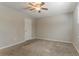 Carpeted bedroom with ceiling fan and natural light at 42 Breckenridge Dr, Powder Springs, GA 30127
