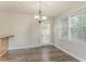Dining area with hardwood floors, a window and a light fixture at 42 Breckenridge Dr, Powder Springs, GA 30127