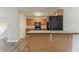 Functional kitchen with wooden cabinets, modern appliances, and an island counter for casual dining at 42 Breckenridge Dr, Powder Springs, GA 30127