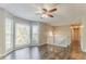 Bright living room with hardwood floors, a ceiling fan, and large windows at 42 Breckenridge Dr, Powder Springs, GA 30127