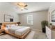 Staged main bedroom with large bed, modern decor, and a ceiling fan at 42 Breckenridge Dr, Powder Springs, GA 30127