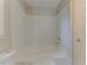 Bathroom featuring a combined tub and shower with bright white walls at 42 Breckenridge Dr, Powder Springs, GA 30127