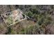 Aerial view of property, showcasing the home, surrounding trees, and spacious lot boundaries at 522 Stell Rd, Woodstock, GA 30188