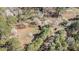Aerial view displaying home and surrounding woodlands; lush landscape and ample privacy at 522 Stell Rd, Woodstock, GA 30188
