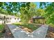 Backyard with manicured lawn and an outbuilding at 522 Stell Rd, Woodstock, GA 30188