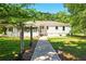Sidewalk leads to back of ranch-style home with green lawn at 522 Stell Rd, Woodstock, GA 30188