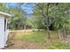 Secluded backyard with mature trees and a gazebo providing a serene atmosphere at 522 Stell Rd, Woodstock, GA 30188