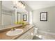 Neutral bathroom featuring double sinks, granite countertops, and bright vanity lighting at 522 Stell Rd, Woodstock, GA 30188