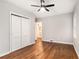 Empty bedroom with hardwood floors and a large closet perfect for storage at 522 Stell Rd, Woodstock, GA 30188