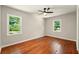 Bright bedroom with natural light, hardwood floors and a ceiling fan at 522 Stell Rd, Woodstock, GA 30188