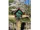 Birdhouse on a fence post at 522 Stell Rd, Woodstock, GA 30188