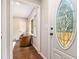 Welcoming entryway featuring a decorative oval glass front door and hardwood flooring at 522 Stell Rd, Woodstock, GA 30188