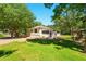 Well-maintained house exterior with a lush lawn and mature trees providing ample shade at 522 Stell Rd, Woodstock, GA 30188