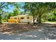 Ranch style home with new deck in front and large lot at 522 Stell Rd, Woodstock, GA 30188