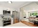 Open concept kitchen with stainless steel appliances that opens into the living room at 522 Stell Rd, Woodstock, GA 30188