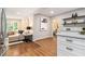 Open-concept layout connecting the living room and kitchen with hardwood flooring at 522 Stell Rd, Woodstock, GA 30188