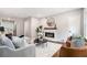 Bright living room featuring a modern fireplace, hardwood floors, and neutral decor at 522 Stell Rd, Woodstock, GA 30188