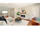 The living room features an electric fireplace, hardwood floors, and flows into a bright kitchen at 522 Stell Rd, Woodstock, GA 30188