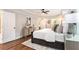 Main bedroom featuring hardwood floors, neutral walls, and a tray ceiling at 522 Stell Rd, Woodstock, GA 30188