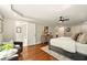 Comfortable main bedroom with hardwood floors, accent seating area, and lots of natural light at 522 Stell Rd, Woodstock, GA 30188