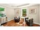 Cozy sitting room with hardwood floors, comfortable seating, and plenty of natural light at 522 Stell Rd, Woodstock, GA 30188