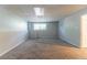Spacious basement with neutral carpet, providing a versatile area for various uses at 142 Wellspring Pt, Hiram, GA 30141