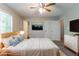Staged bedroom with a bed, artwork, and stylish decor at 142 Wellspring Pt, Hiram, GA 30141