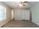 Comfortable bedroom with neutral walls, carpet, and natural light at 142 Wellspring Pt, Hiram, GA 30141
