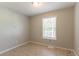 Neutral bedroom with a window that brings in natural light, enhancing the room's inviting atmosphere at 142 Wellspring Pt, Hiram, GA 30141