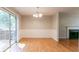 Dining area with sliding glass doors and adjacent to the living room at 142 Wellspring Pt, Hiram, GA 30141