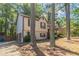 A cozy two-story home features an attached garage and well-maintained landscaping at 142 Wellspring Pt, Hiram, GA 30141