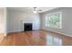 Bright living room featuring a fireplace and hardwood floors at 142 Wellspring Pt, Hiram, GA 30141