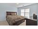 Bedroom featuring a queen-size bed and a side table at 1885 Hickory Station Cir, Snellville, GA 30078