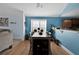 Stylish dining area featuring hardwood floors and view of living room at 1885 Hickory Station Cir, Snellville, GA 30078