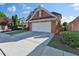 Well-maintained home featuring a long driveway leading to an attached two-car garage at 1885 Hickory Station Cir, Snellville, GA 30078