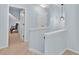Hallway with neutral carpet and access to additional rooms at 1885 Hickory Station Cir, Snellville, GA 30078