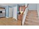 Kitchen area and staircase showcasing hardwood floors and convenient access to upper level at 1885 Hickory Station Cir, Snellville, GA 30078